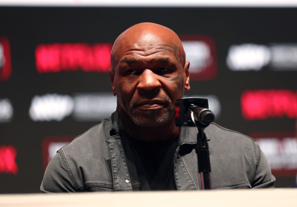 Mike Tyson looks on at a press conference with Jake Paul