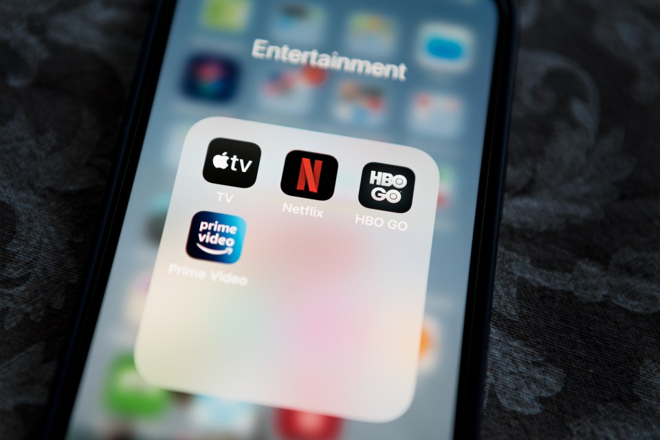 a phone screen shows the app icons for apple tv netflix and hbo go