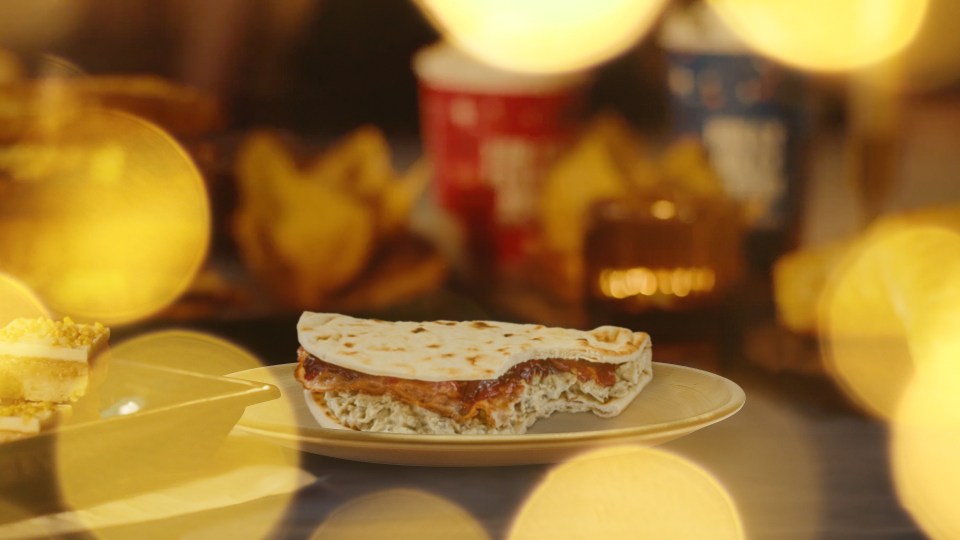 a slice of pizza on a plate with a blurred background