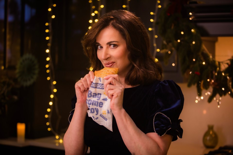 a woman is holding a bag that says bag some joy