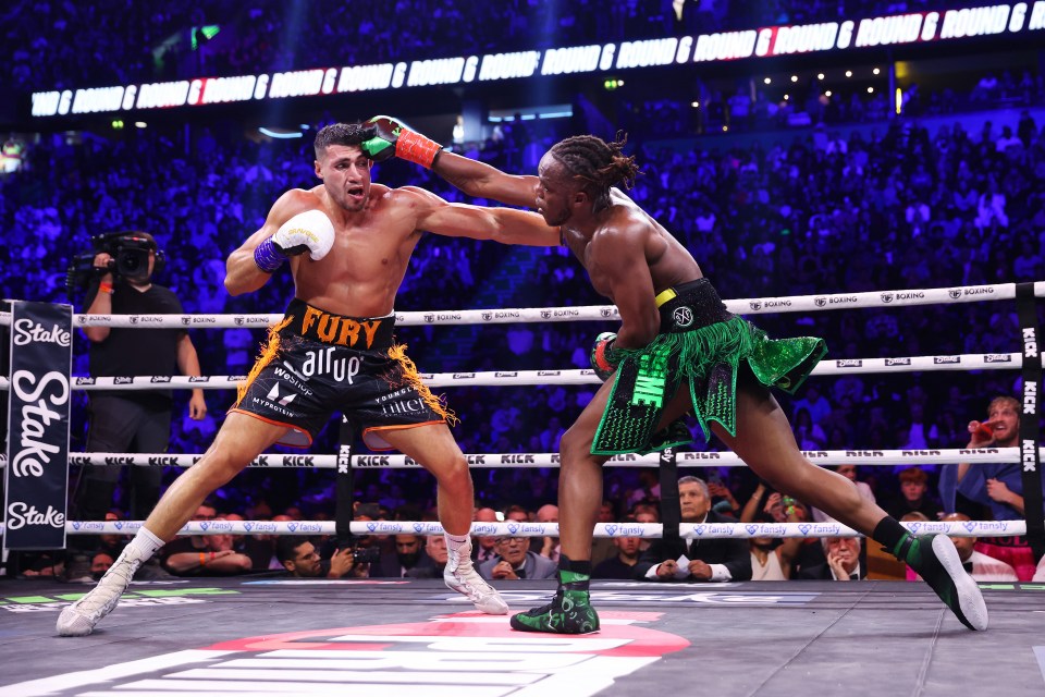 a boxer with the word fury on his shorts