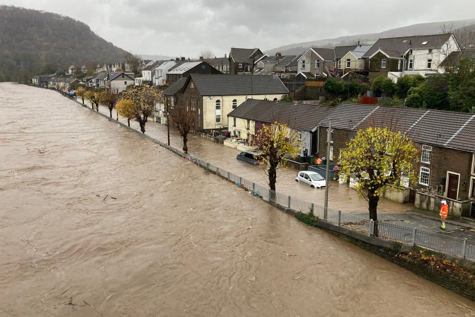 Cars are completely submerged after the River Taff burst its banks