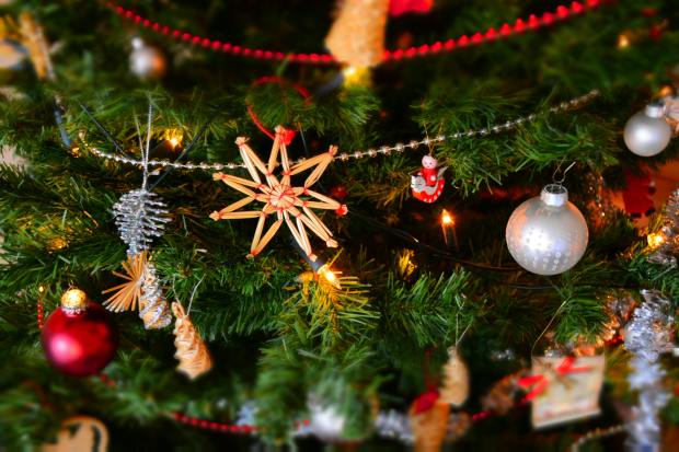 a pile of christmas presents under a christmas tree