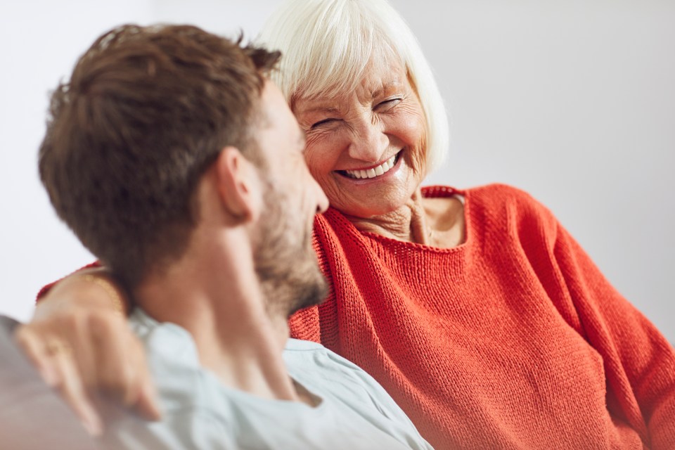 Portrait of senior woman with her grown-up grandson