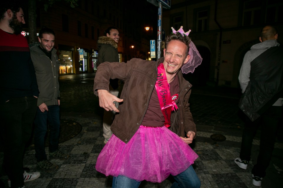 a man wearing a sash that says miss bride