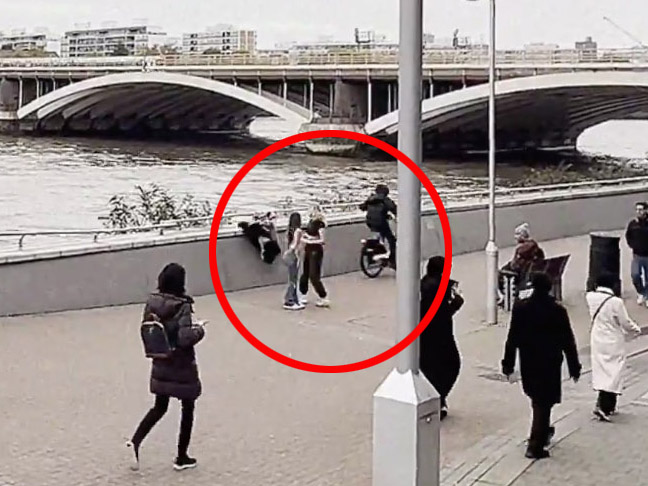 The cyclist speeds off with the device as the two women watch in shock