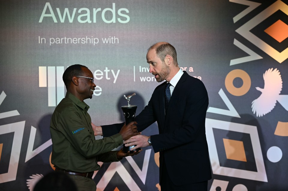 The Prince of Wales presented the Tusk Wildlife Ranger Award Winner to Claver Ntoyinkima