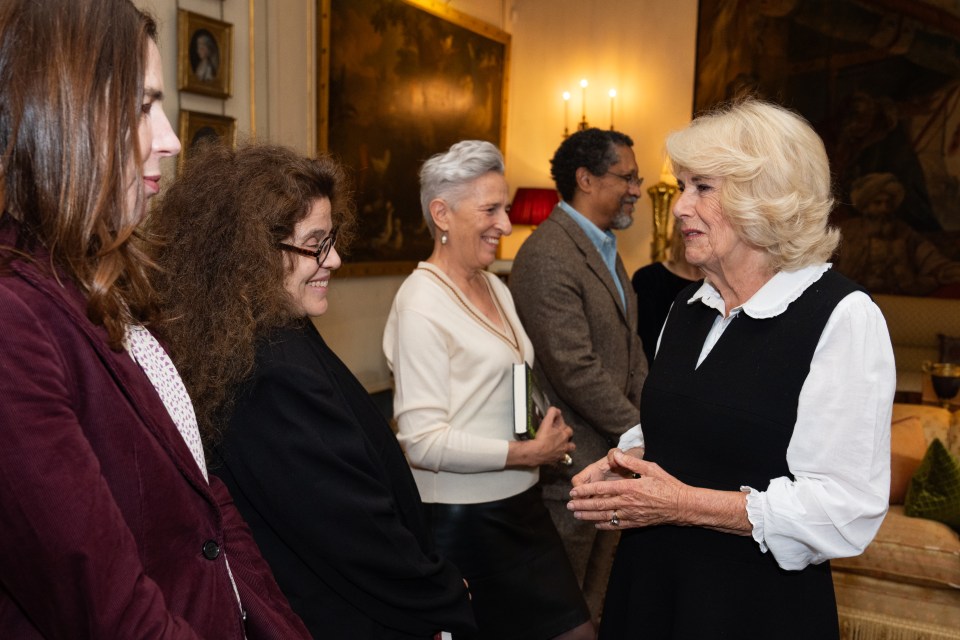 Queen Camilla talks with Anne Michaels during the reception