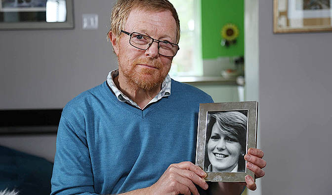 Richard Lamplugh holding a photograph of his missing sister Suzy, whose body has never been found