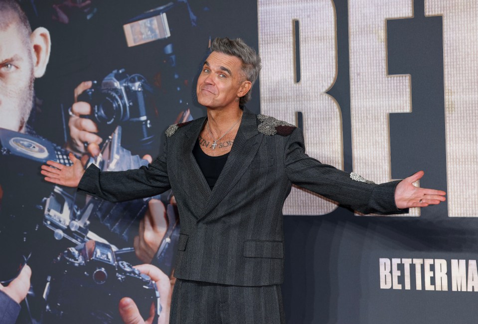 Robbie posed for photographers before a screening of the film, which depicts him as a CGI monkey