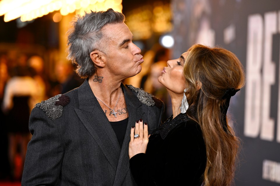 He put on a loved-up display with his wife in front of the assembled photographers