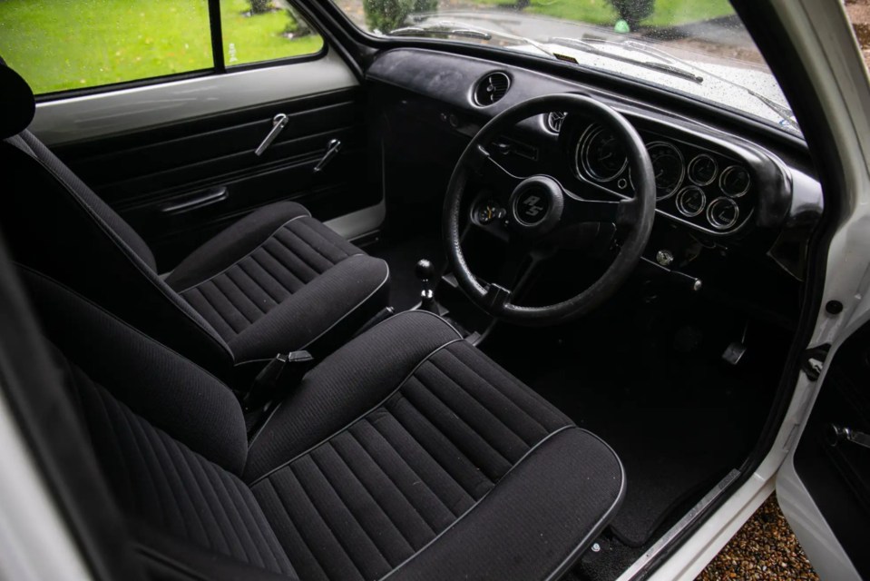 The classic interiors feature an all-black design with fabric seats