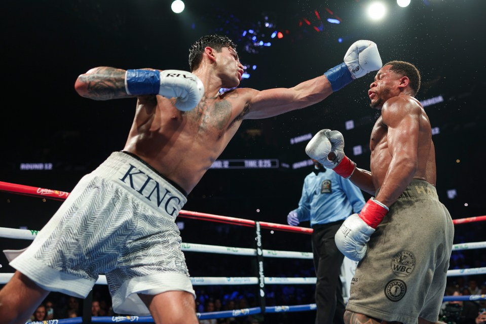 two boxers in a ring with one wearing king shorts