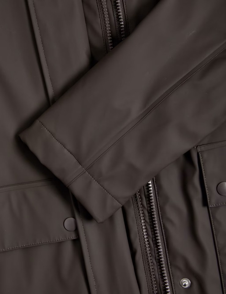 a close up of a brown leather jacket with a zipper