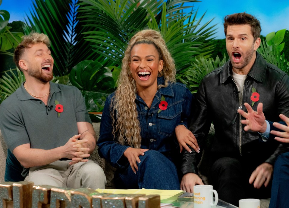 three people sit on a couch in front of a sign that says morning show