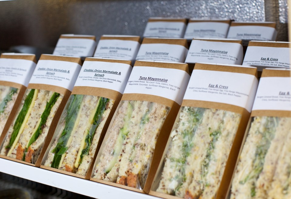 a row of sandwiches with one labeled tuna mayonnaise