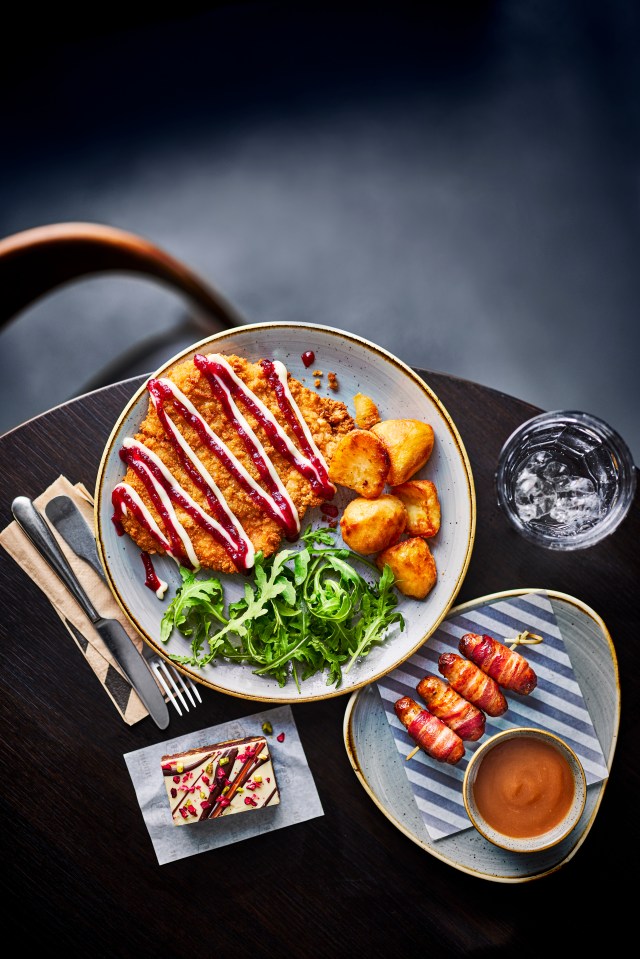 a plate of food with meat and potatoes on a table