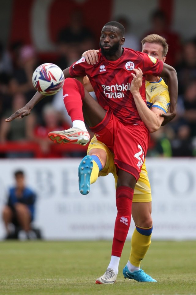 CRAWLEY, ENGLAND - JULY 27: Muhammadu Faalof Crawley Town is challenged for the ball by Rob Holding of Crystal Palace during the pre-season friendly match between Crawley Town and Crystal Palace at Broadfield Stadium on July 27, 2024 in Crawley, England. (Photo by Steve Bardens/Getty Images)