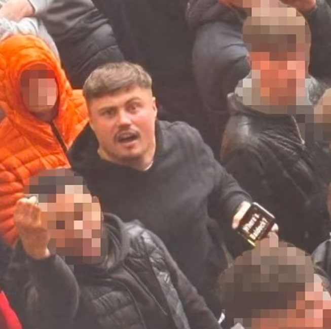 A fan was seen holding a phone up to rival Sheffield United supporters with the question 'Where's Baldock?' across the screen