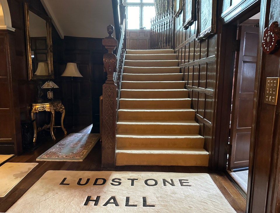 a rug that says ludstone hall on it