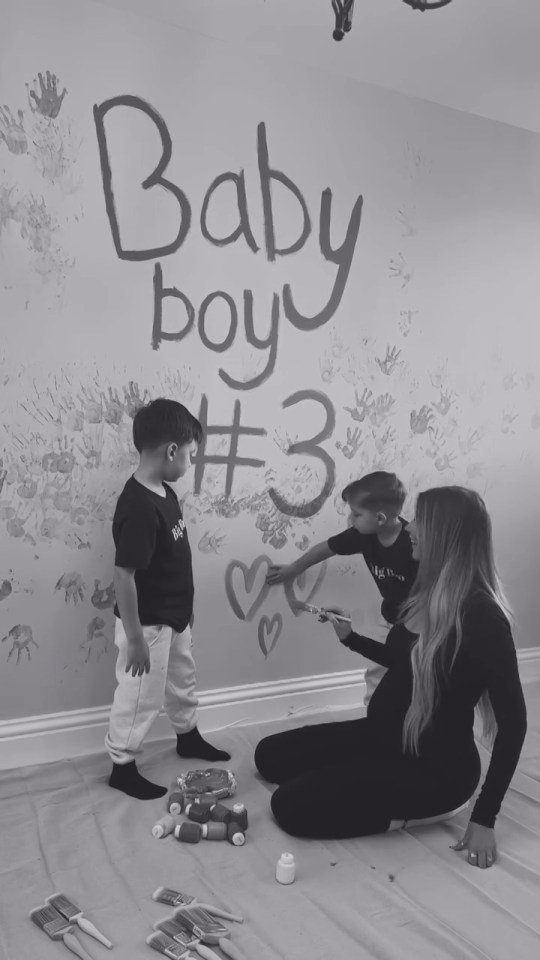 a baby boy # 3 is being painted on a wall