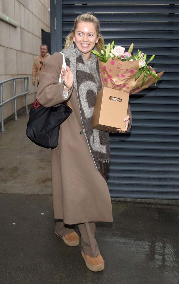 Tasha arrived with a giant bouquet of flowers