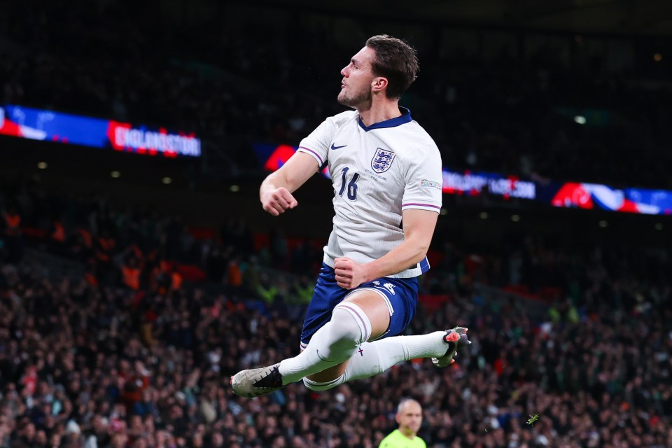 a soccer player with the number 16 on his jersey jumps in the air