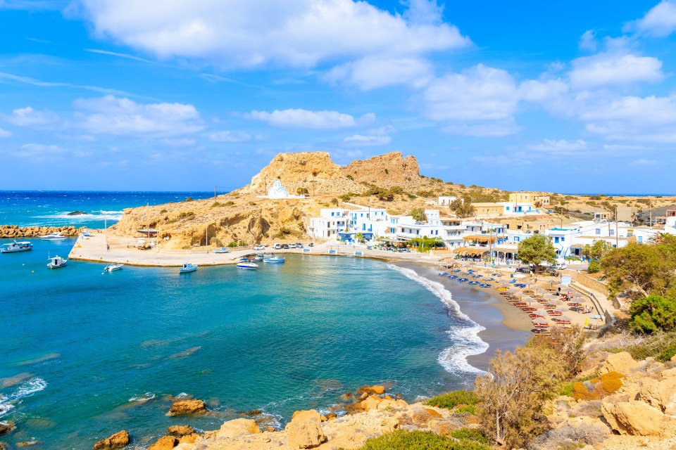 a small town sits on a small island in the middle of the ocean