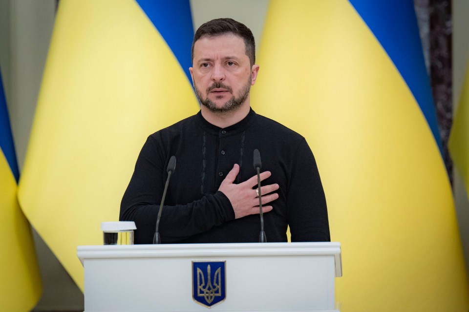 a man stands at a podium with a flag on it