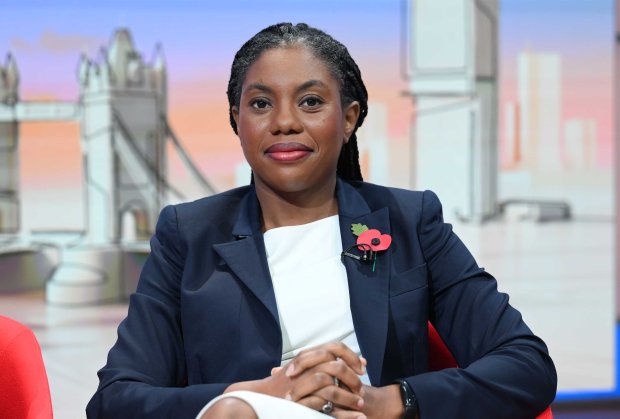 a woman with a poppy pin on her jacket