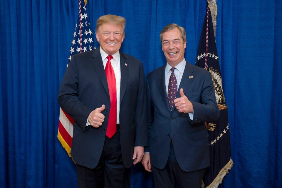 two men giving a thumbs up in front of an american flag