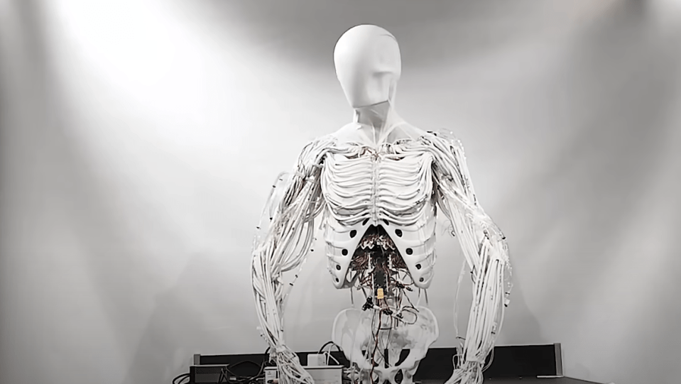 The robot is able to move its head like a human, with the white skin stretching as it twisted