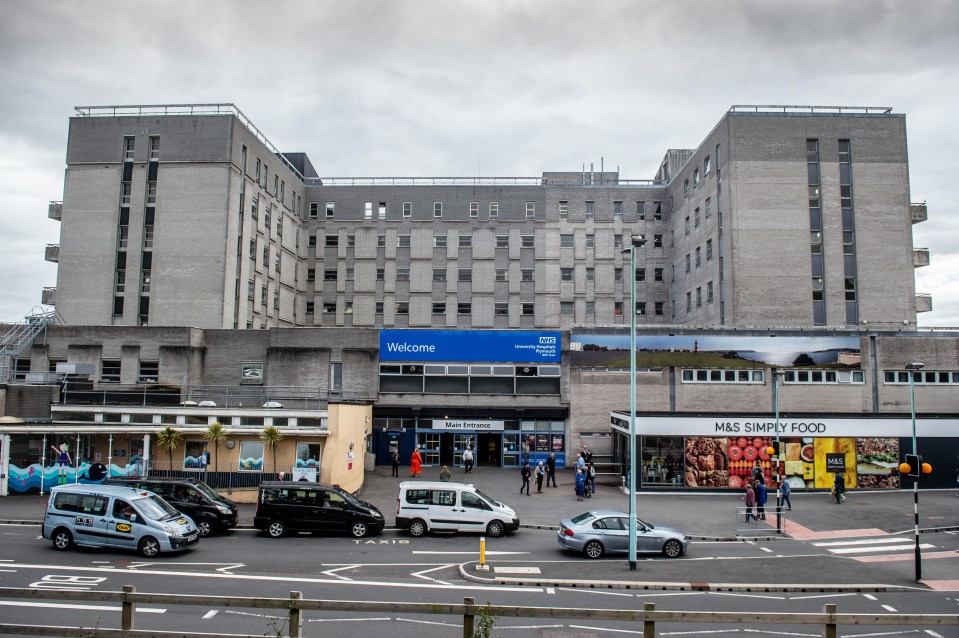 a large building with a blue sign that says welcome