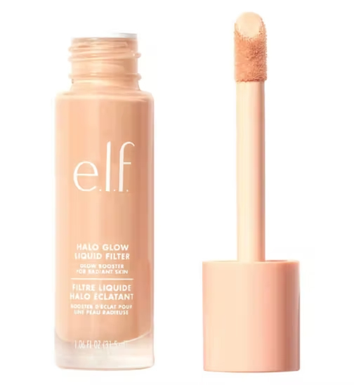 a bottle of elf halo glow liquid filter next to a brush