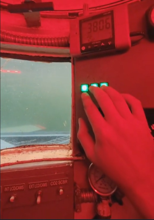 Hand operating controls in a submersible vehicle.