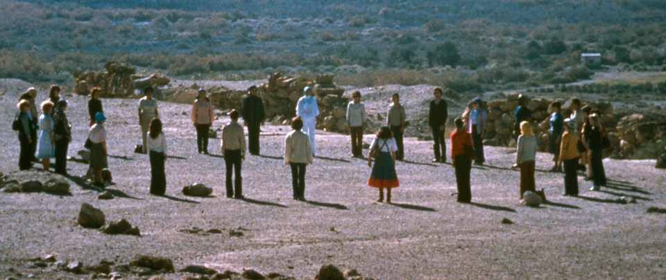 Cult members standing in a circle