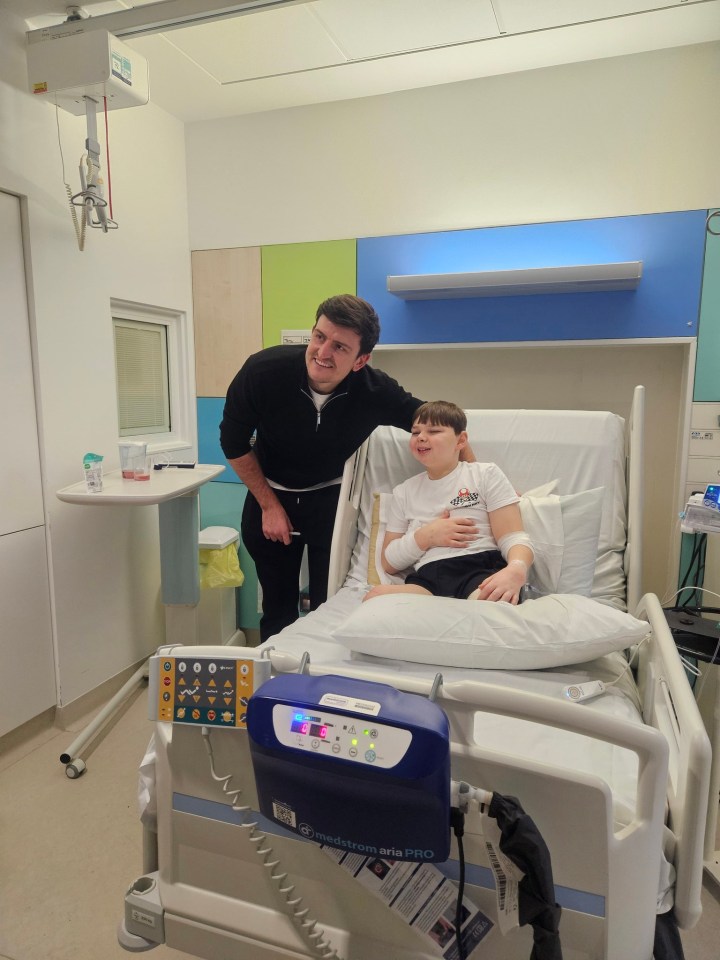 Harry Maguire visits a young boy in the hospital after hip surgery.