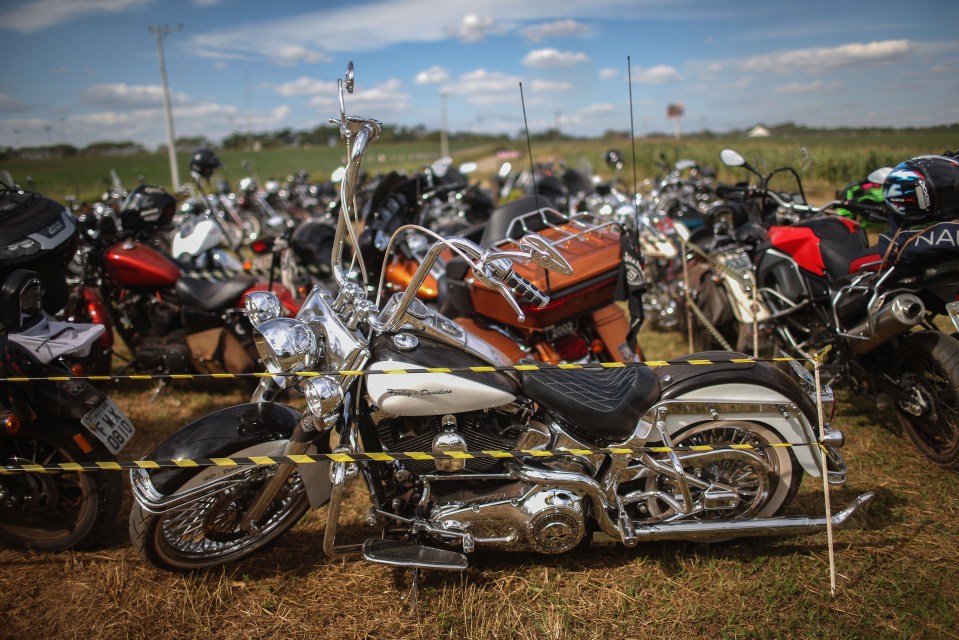 A Harley-Davidson is parked along with other motorcycles during the Festa Confederada