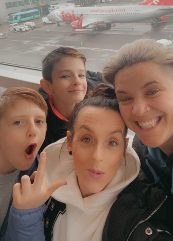 Dionne and her partner taking a selfie at the airport