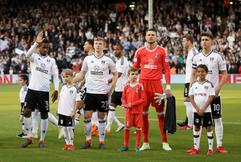 Ryan Sessegnon of Fulham waves as teams line up before a match.