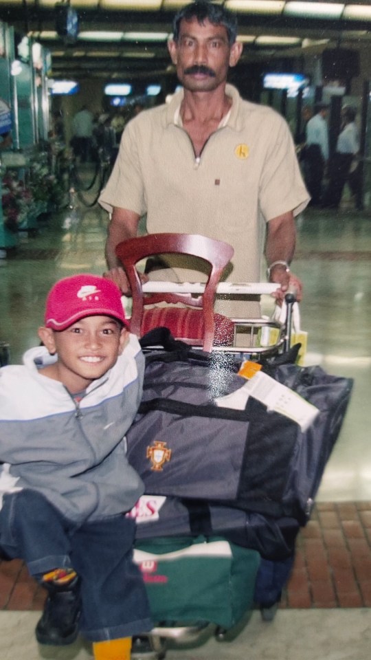 Martunis and his dad arriving at an airport in Portugal, after being flown out by the country's national football team