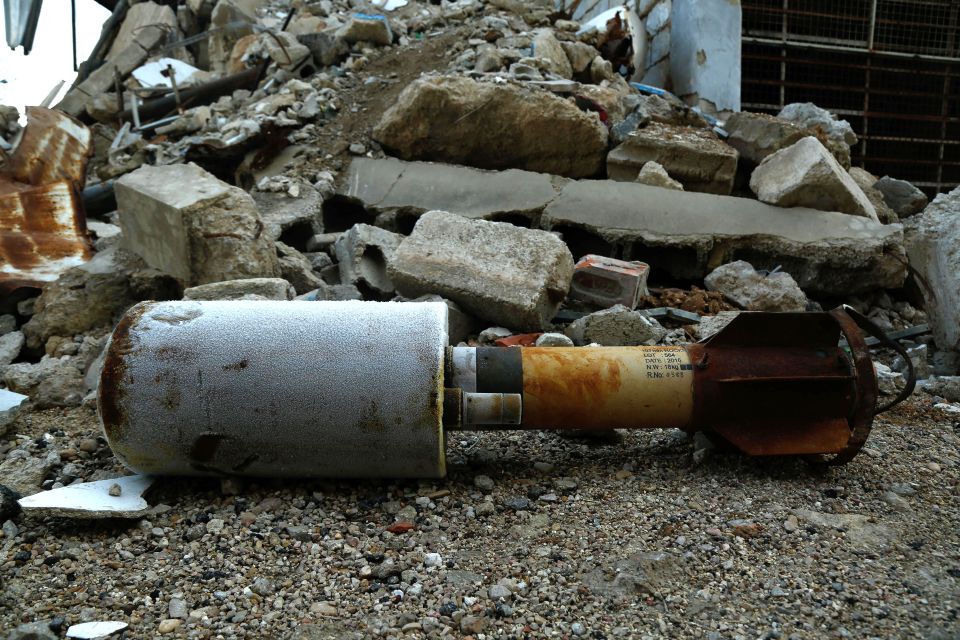 A close-up shot shows an empty rocket reportedly fired by Syrian regime forces on the rebel-held besieged town of Douma in the eastern Ghouta region