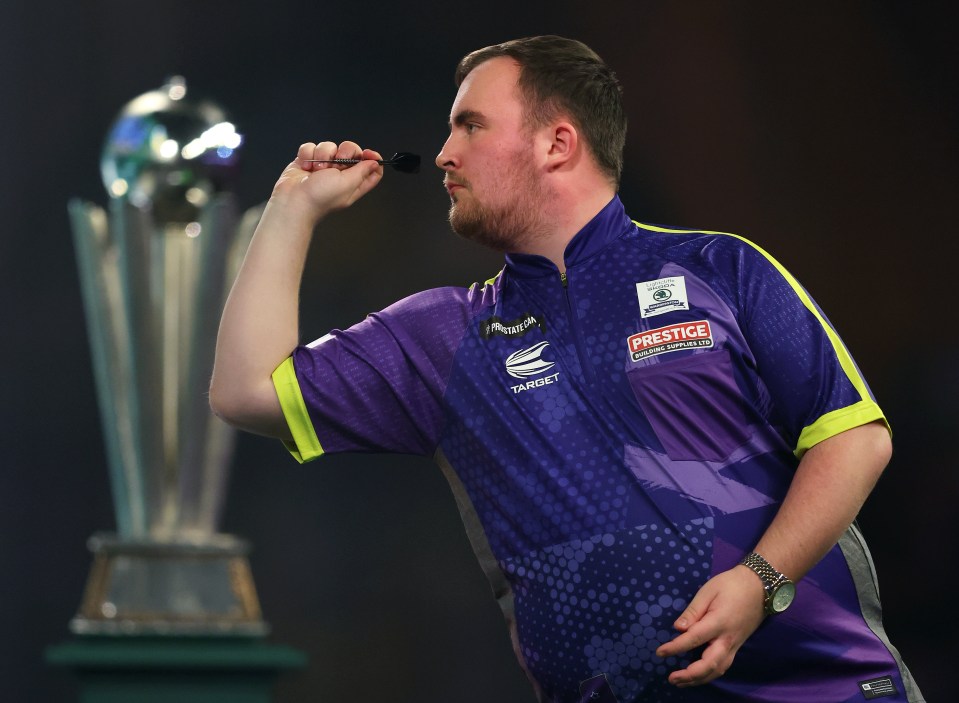 Luke Littler throwing a dart during the World Darts Championship.