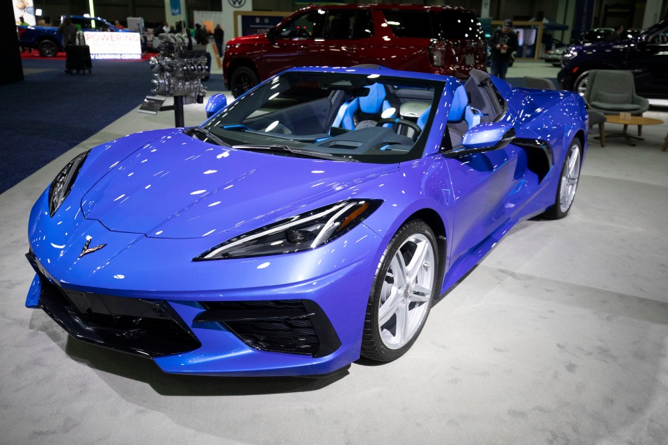 Blue Chevrolet Corvette E-Ray convertible on display at the North American International Detroit Auto Show.