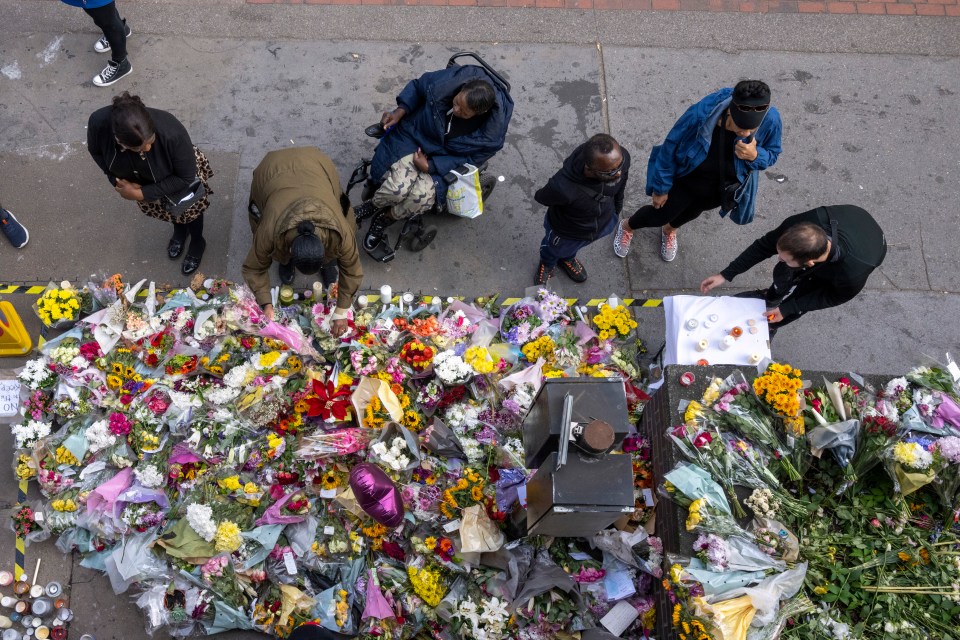 Flowers and tributes are placed near scene of the fatal stabbing last year