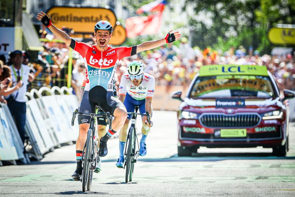 Victor Campenaerts celebrates as he crosses the finish line to win stage 18 of the 2024 Tour de France