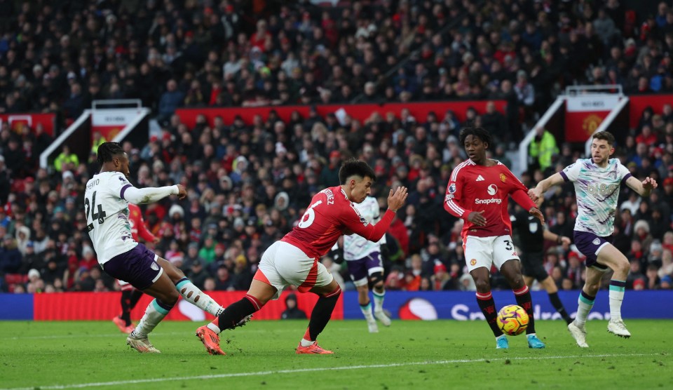 Antoine Semenyo scoring a goal during a soccer match.