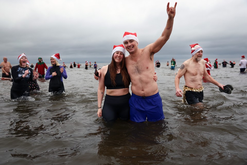 Dozens of Brits jumped into the cold water, with some even wearing tinsel