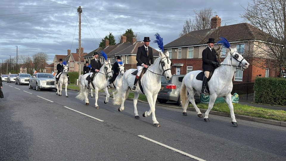 A number of horses adorned with feathers featured in the funeral