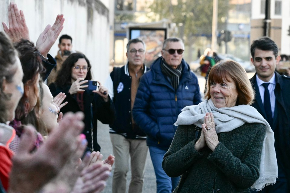 Gisèle Pelicot (R) followed by her lawyer Stephane Babonneau (far right), is applauded by women outside the Avignon courthouse in November